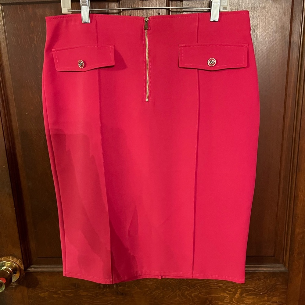 NWT knee length pink skirt with front zipper.